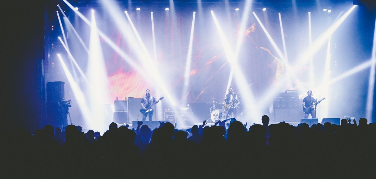 Panoramic view of a crowd at a live music concert